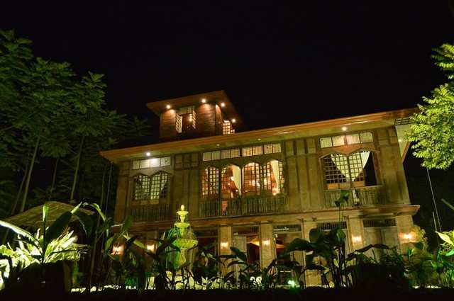 Kampo Juan heritage house illuminated at night