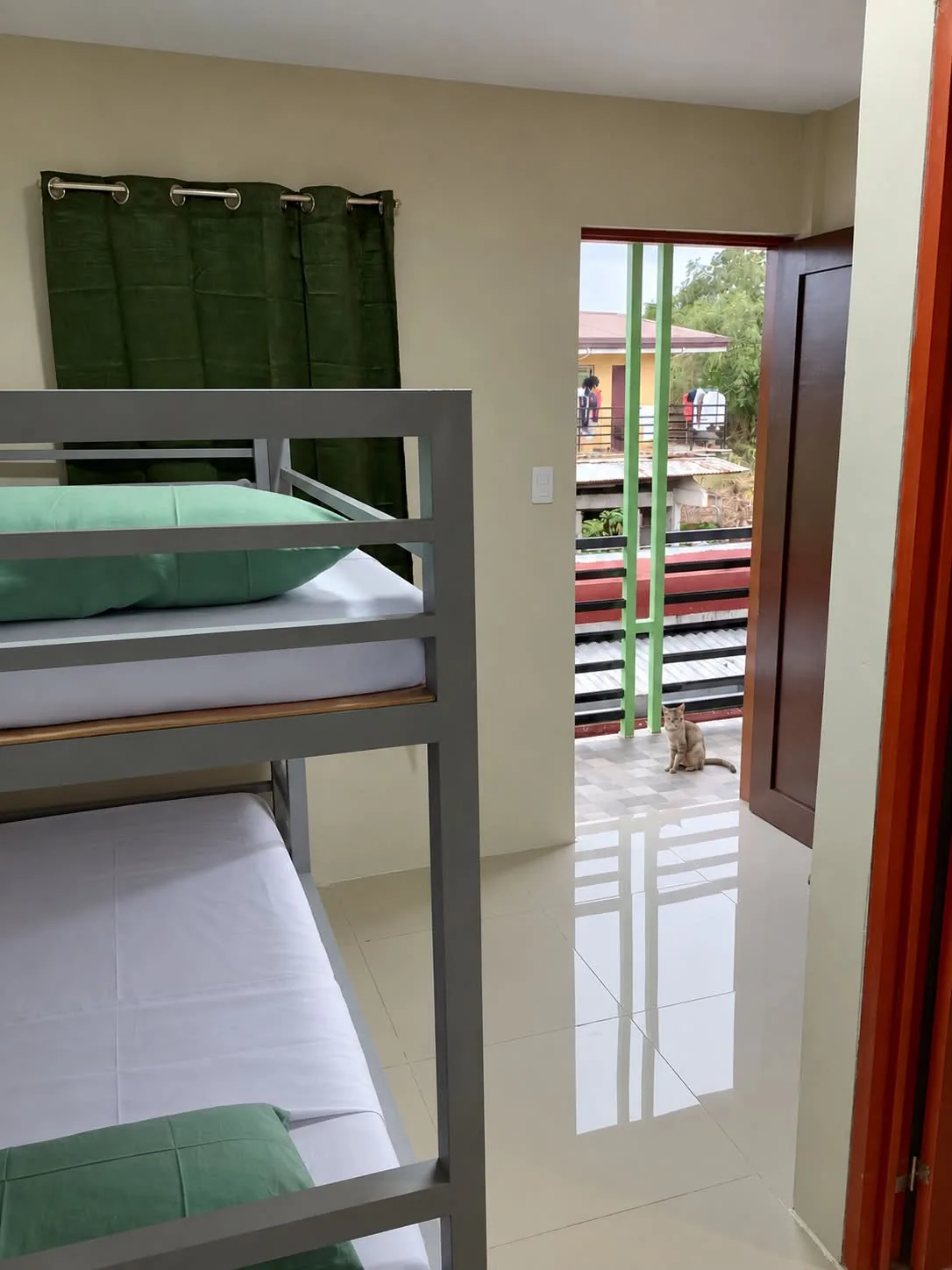Sleeping area beside the corridor entrance at Rohan’s Boarding House in Alae, Manolo Fortich